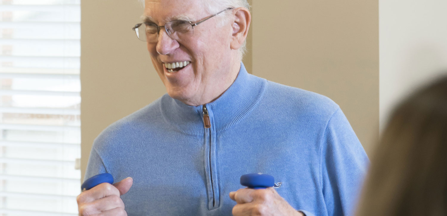 Senior man working out with dumbells