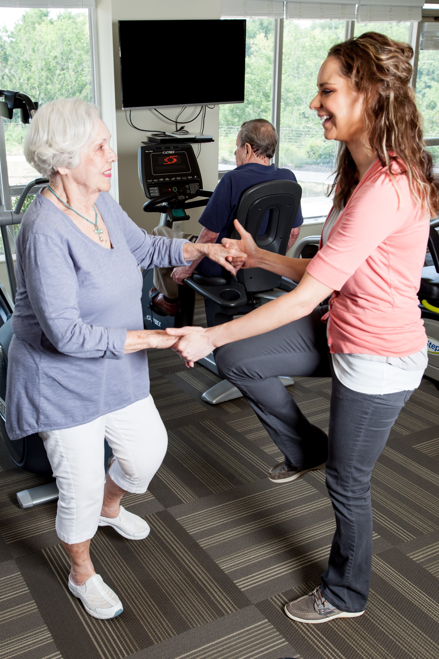 Assisted Living resident works with physical therapist 