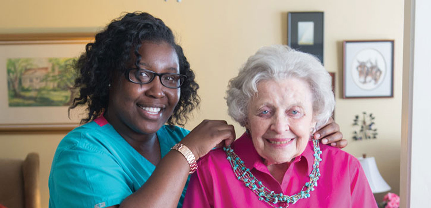 Senior smiling with caregiver