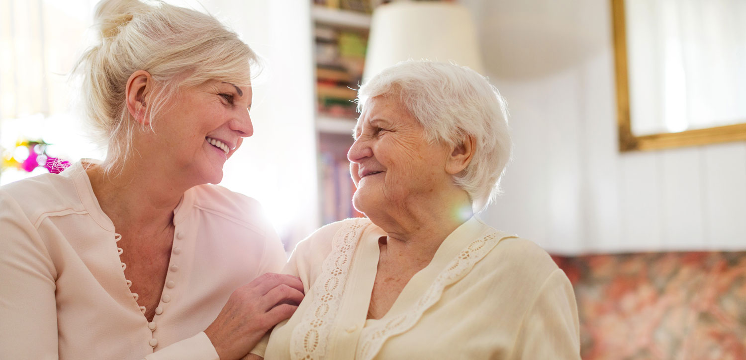 Senior and caregiver talking